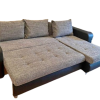 Sofa bed with built-in storage in contemporary living room Elegant corner sofa bed extended into sleeping position