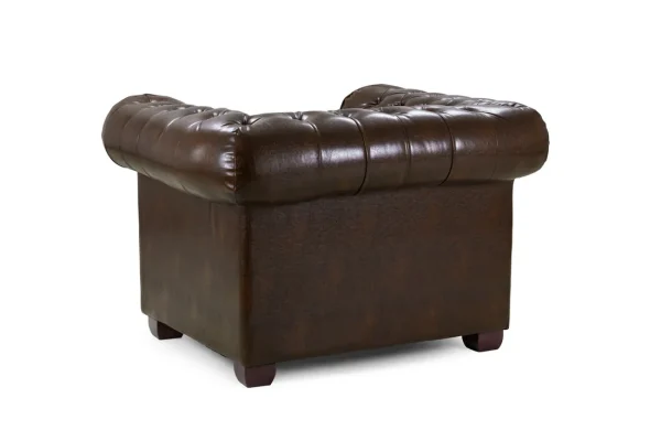 Armchair with scroll arms and metallic studs in brown leather finish Traditional Chesterfield armchair with deep tufting and wooden frame