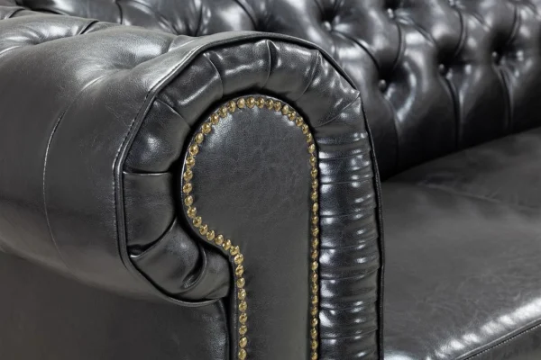 Chesterfield Sofa Black 3 Seater with button-tufted design Black leather Chesterfield 3 seater with wooden feet Front view of classic black Chesterfield sofa Side angle of antique black Chesterfield 3 seater Chesterfield sofa black 3 seater in a modern living room