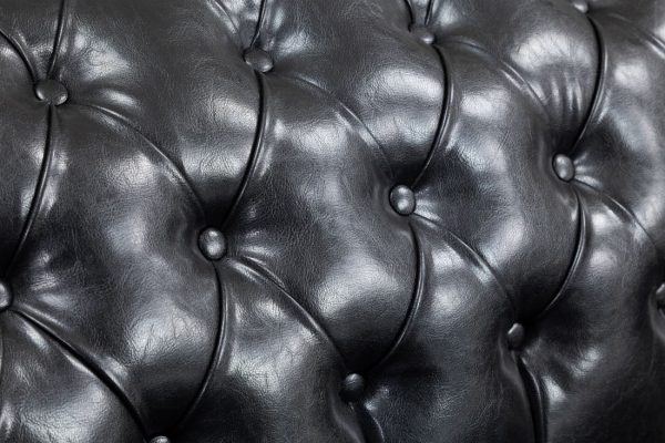 Front view of antique black PU leather Chesterfield sofa