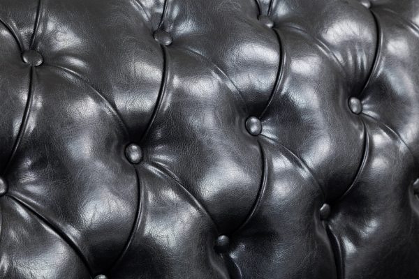 Front view of classic black Chesterfield sofa