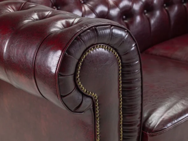 Classic Chesterfield armchair with metallic studs and bonded leather upholstery